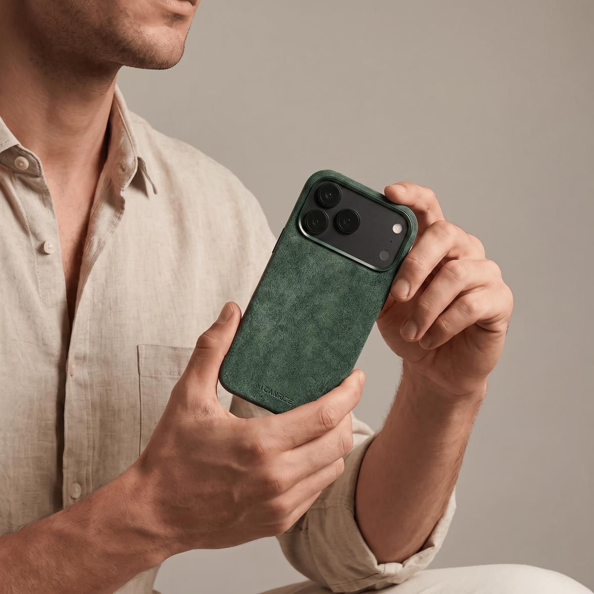 Midnight Green Alcantara case for iPhone 18 Pro held in hands